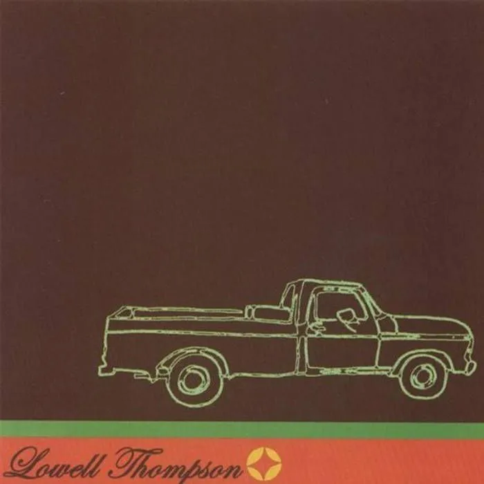 A green line drawing of a pickup truck on a brown sleeve, with the name Lowell Thompson in script along the bottom.